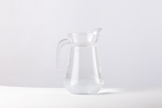 glass jug with water isolated on white background