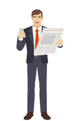 Businessman with mobile phone and newspaper