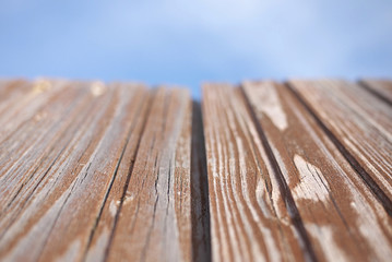 Red old wood textured background with blue sky