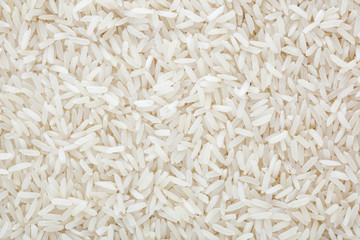 Uncooked white long-grain rice background