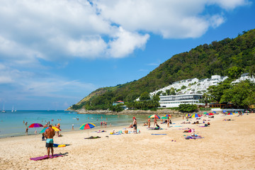 Tourists on the Nai Harn beach - one of the best beaches in Phuket, Thailand 