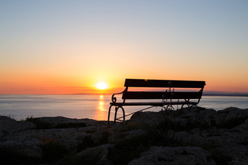 Sunset beach and bench