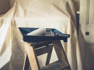 Obraz premium Paint roller on stepladder