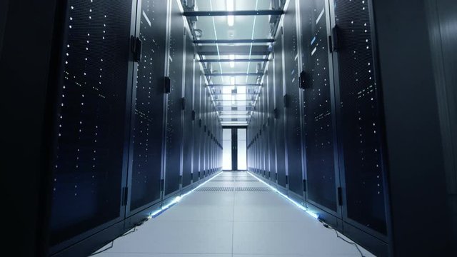 Camera Moves Through Opening Doors Into Data Center. Rack Servers are Ultra Modern and Lit by LED Lights.  Shot on RED EPIC-W 8K Helium Cinema Camera.