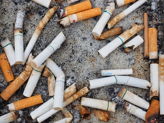 Cigarettes in ashtray, flat lay photography