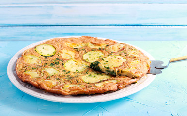 Zucchini and spinach frittata on plate