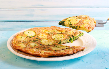Zucchini and spinach frittata on plate