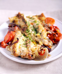 Grey mullet baked with vegetables