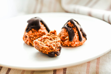 Candy with peanuts, honey and chocolate, homemade healthy dessert