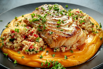 Soy-glazed cod loin fillet with cous-cous salad on butternut squash puree