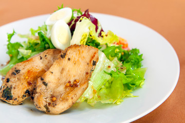 Caesar salad in white plate