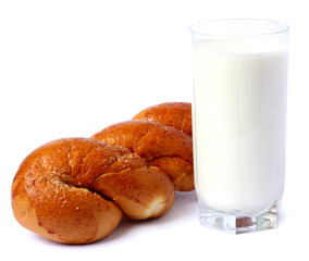 Glass of fresh milk with biscuit isolated on white background