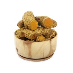 turmeric in wooden cup isolated
