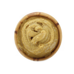 mustard in wooden cup isolated