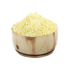 ground dried rind of lemon in wooden cup isolated