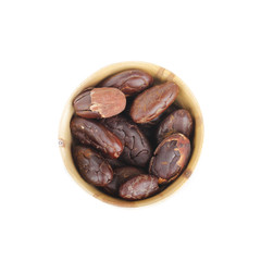 cacao beans in wooden background isolated