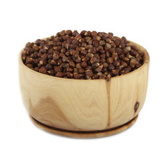 Aframomum melegueta in wooden cup isolated
