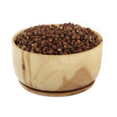 Aframomum melegueta in wooden cup isolated