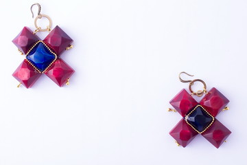 Colorful bright earrings isolated on white background