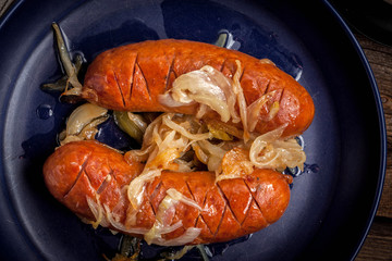 Fried sausage with onions.