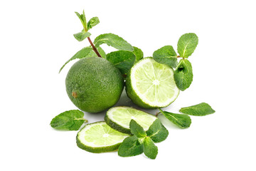 Lime. fruit with a half isolated on whiteFresh tasty lime fruit with mint leaves.