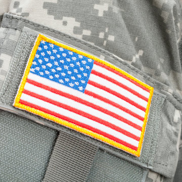 Close up studio shot of U.S. flag patch on solders uniform