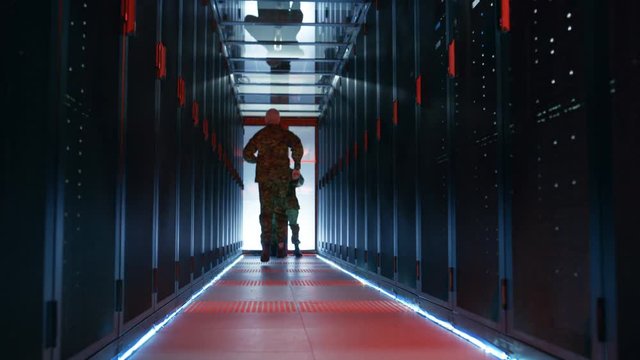 Security Alarm with Flasher Triggered in Data Center. Two Military Men Running in the Corridor full of Server Racks.   Shot on RED EPIC-W 8K Helium Cinema Camera.