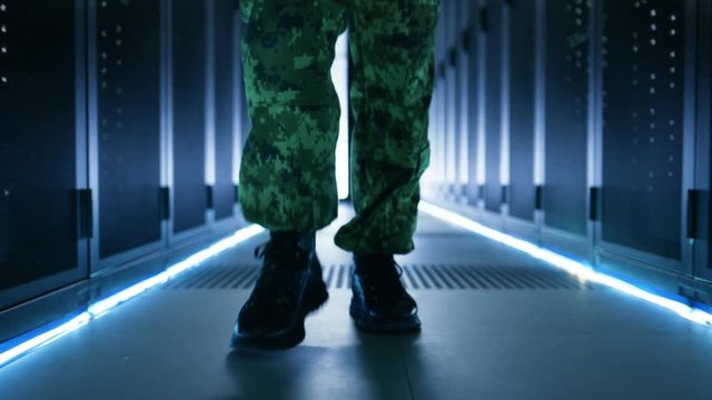 Follow up Shot of Soldier's Legs. He's Walking in Ultra Modern Top Secret Military Data Center Facility.  Shot on RED EPIC-W 8K Helium Cinema Camera.