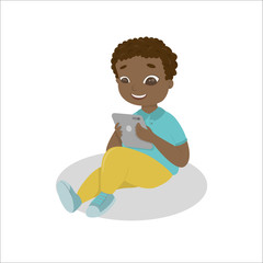 Boy with gadgets on white background. African american boy with tablet. Computer addiction.