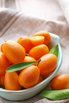 Fresh kumquats closeup in a bowl