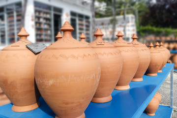 Group of red handmade ceramic jugs