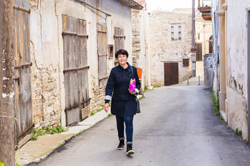 Stylish woman walking around old town. Female outdoors