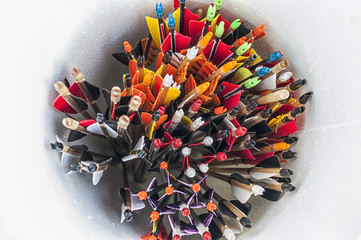 Closeup on a bunch of arrows stored in a tube. Nock and fletching