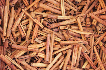 Cinnamon stick background. Group of cinnamon in market. Top view. Carmella stick close up.