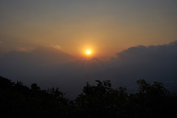 Sunset in volcanic highlands of Guatemala / Evening hours on volcano trekking tour next to Antigua in Guatemala 