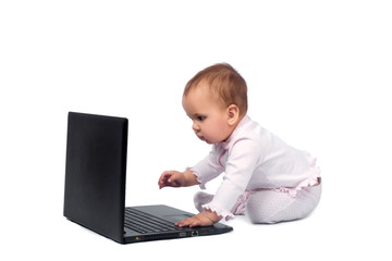 Smiling baby and laptop isolated on white