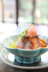 Sushi don , raw sushi salmon tuna octopus and egg on rice , Japanese food