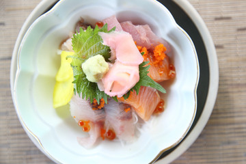 Sushi don , raw sushi salmon tuna octopus and egg on rice , Japanese food