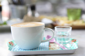 cappuccino coffee on wood background