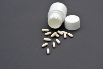 Pills on a black background
