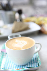 cappuccino coffee on wood background