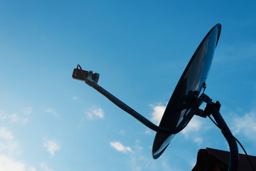 Satellite antenna against with blue sky background