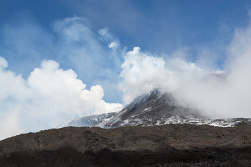 Billowing smoke and lava on Mt. Etna, Sicily, Italy