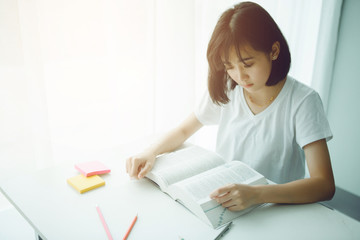 Portrait of a beautiful Asia woman studying at home