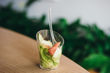 Two mini salads with sauce. Selective focus. Catering for party in restaurant.