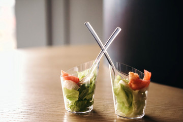 Two mini salads with sauce. Selective focus. Catering for party in restaurant.