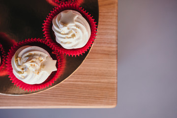 Chocolate cupcake with cream cheese icing with space for text.