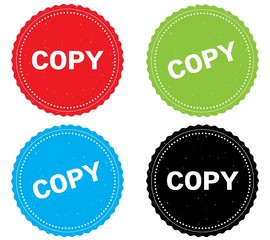 COPY text, on round wavy border stamp badge.