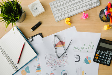 business document in office workplace with computer,flare light,selective focus