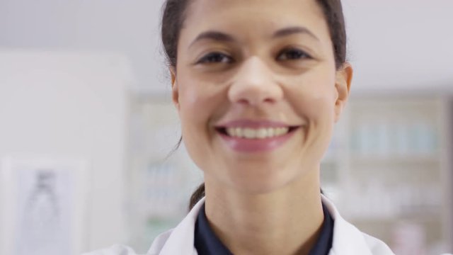  Optician puts a pair of glasses on a patient, as seen from patient's pov.